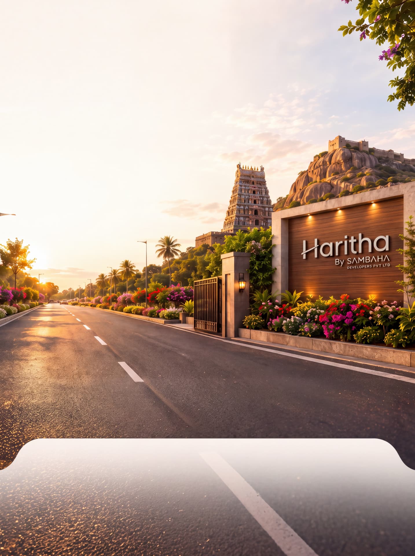 Approach road to Haritha with Rockfort and temple gopuram in the distance